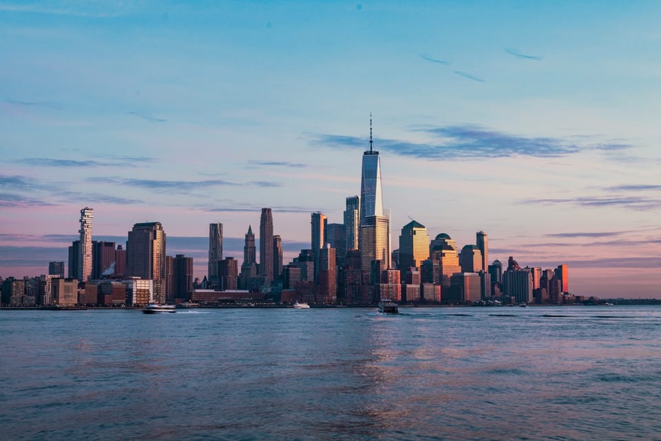 New York City skyline and One World Trade Center at golden hour, on a post about EB-1A, O-1 and EB-2 NIW approvals with self-sponsored visa support