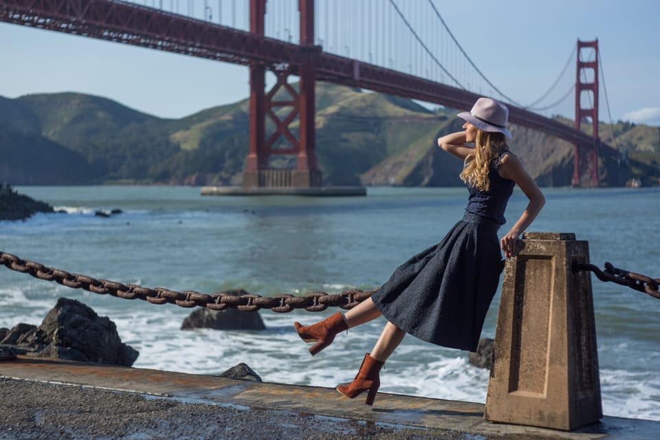 Sylvia Gorajek of America Unlocked by the bay with the Golden Gate Bridge behind her, on EB-2 NIW policy updates and immigration support
